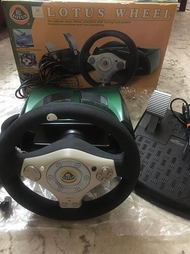 xbox_official_lotus_steering_wheel_and_pedals_combo_by_gamester_1577001934_05ab3ccb_progressive